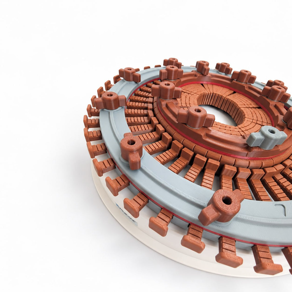 Close-up angled view of a brown 3D printed formillion inserted inside a gray and white hat conformer, showing the adjustable fingers, locking screws, and alignment markers used to transfer an individual head shape