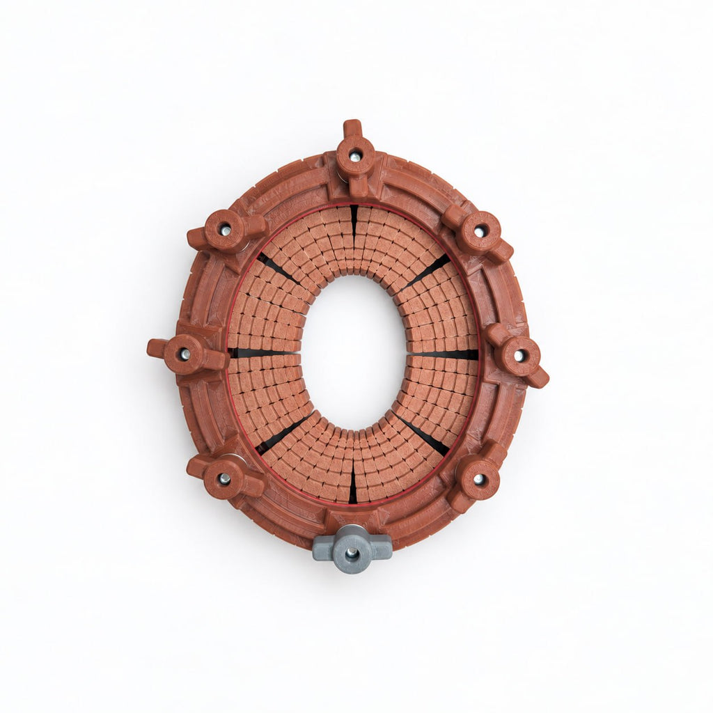 Overhead view of a plastic 3d printed hat formillion showing concentric rows of adjustable fingers, individual locking screws, and a gray alignment knob used to reproduce a customer’s head shape for custom hat fitting