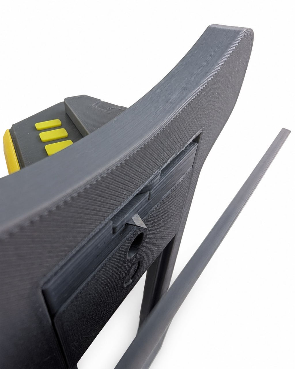 Close-up of 3D printed hat brim cutter showing the angled cutting blade and guide mechanism from the underside