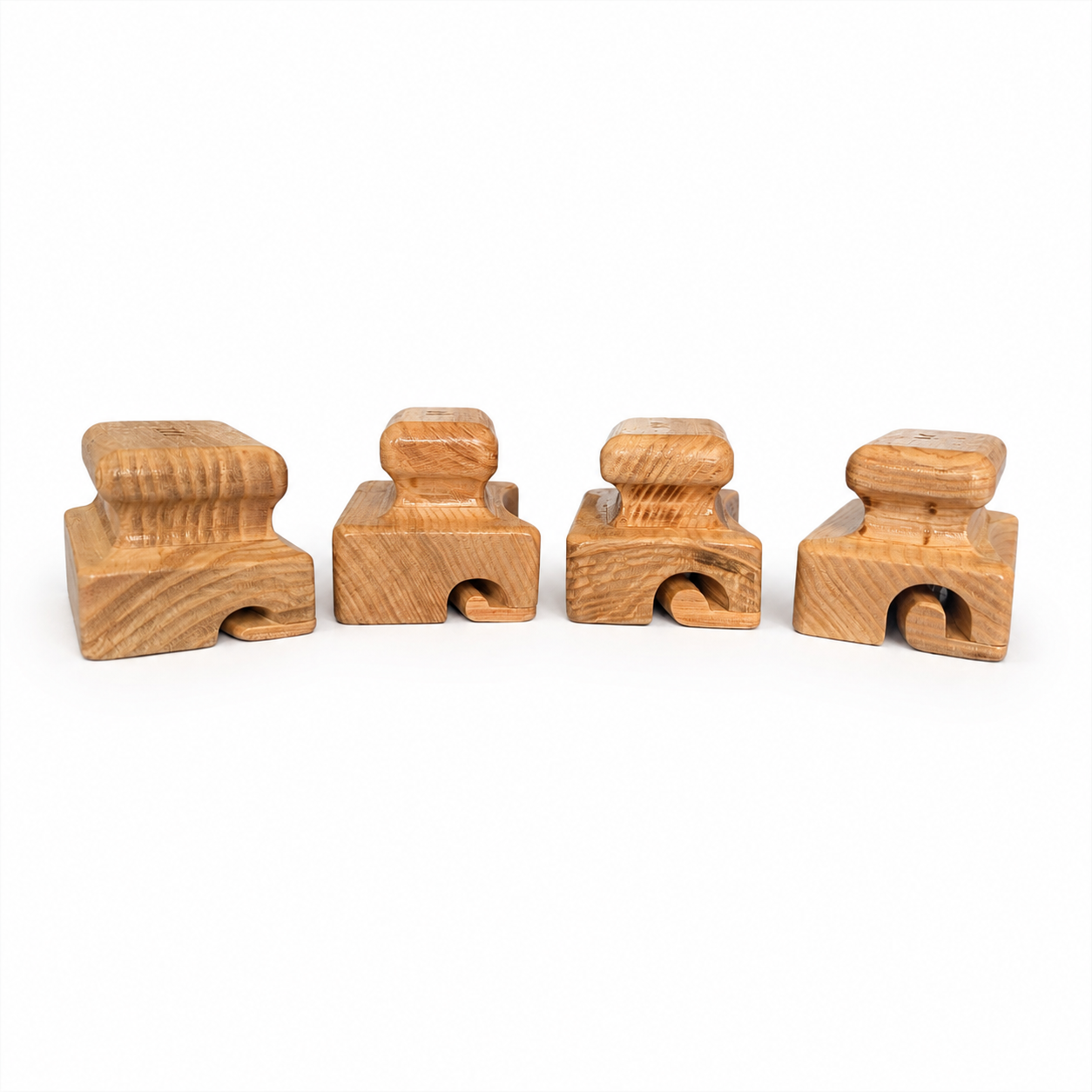 Four wooden hat brim curlers with different groove sizes for shaping felt hat brims