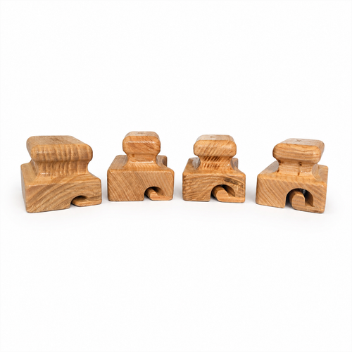 Four wooden hat brim curlers with different groove sizes for shaping felt hat brims