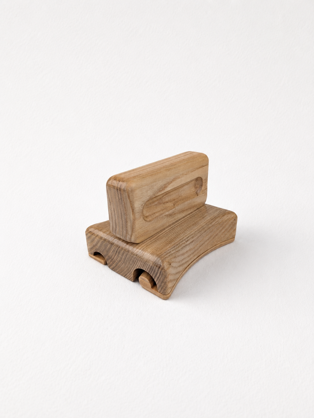 Side view of wooden double brim curler with two grooves for rolled felt hat brims