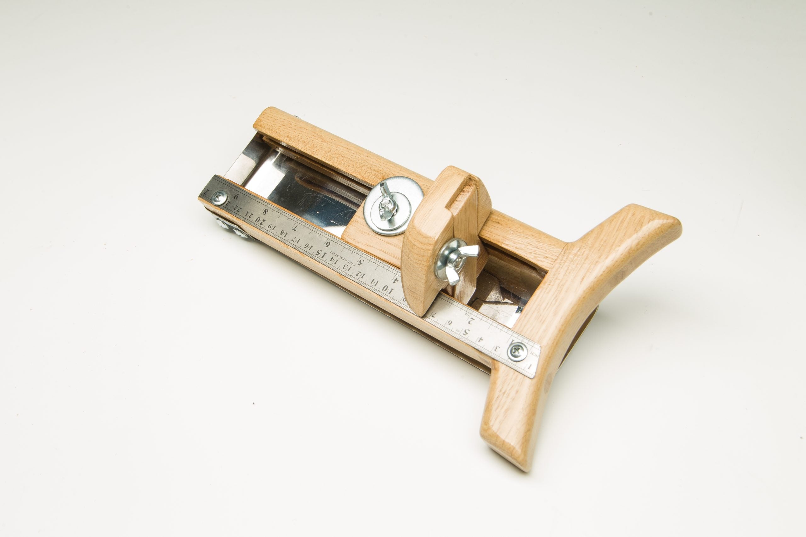 Wooden hat brim cutter with metal ruler and adjustable cutting guide