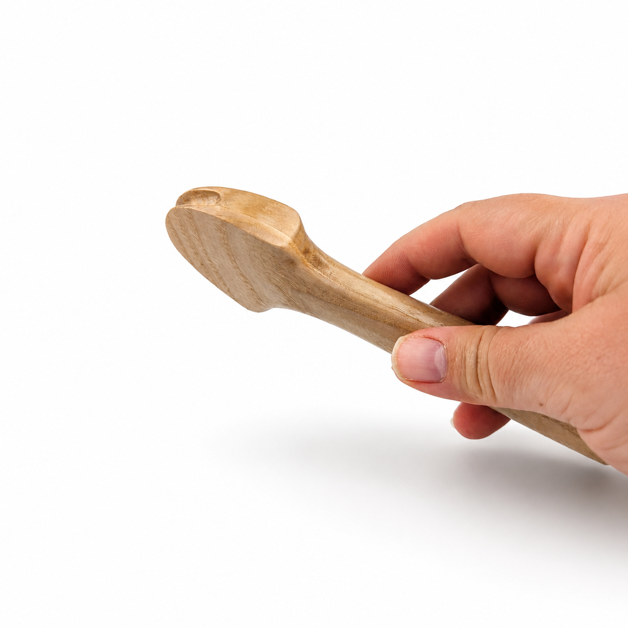 Wooden pusher downer held in hand for millinery cord pressing
