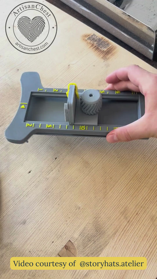 Hatmaker demonstrates a 3D printed hat brim cutter by rotating the tool, changing the blade, and trimming the edge of a felt hat.