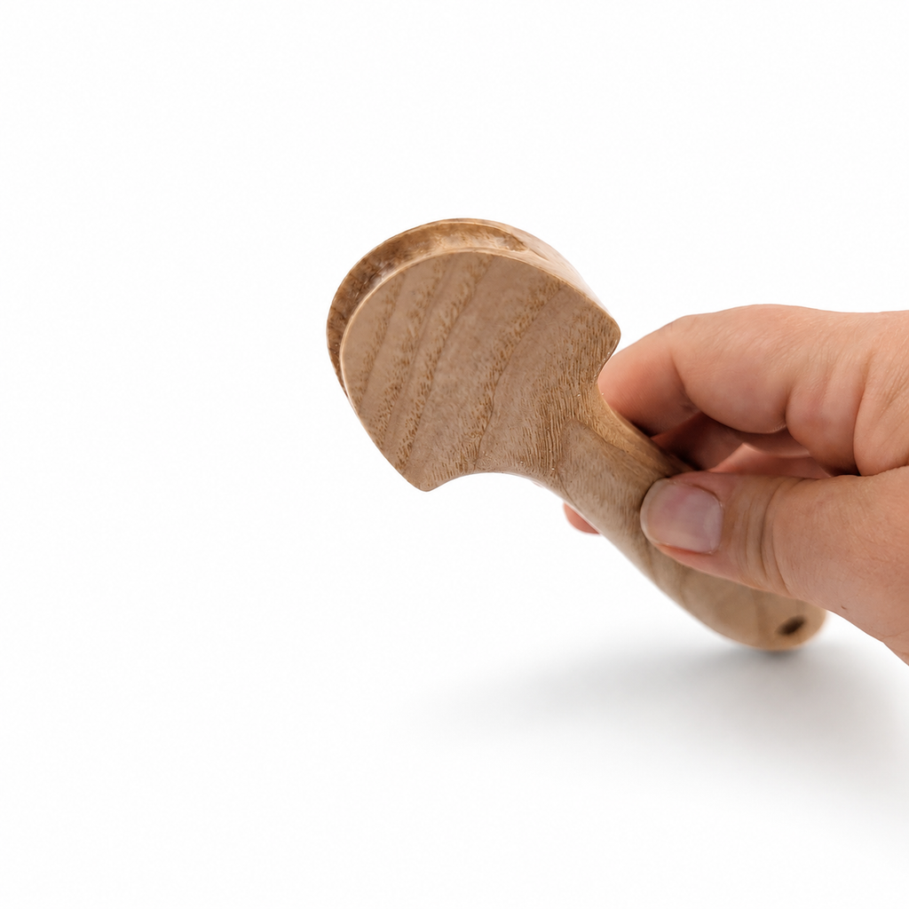 Close-up of wooden pusher downer head with grooved working end